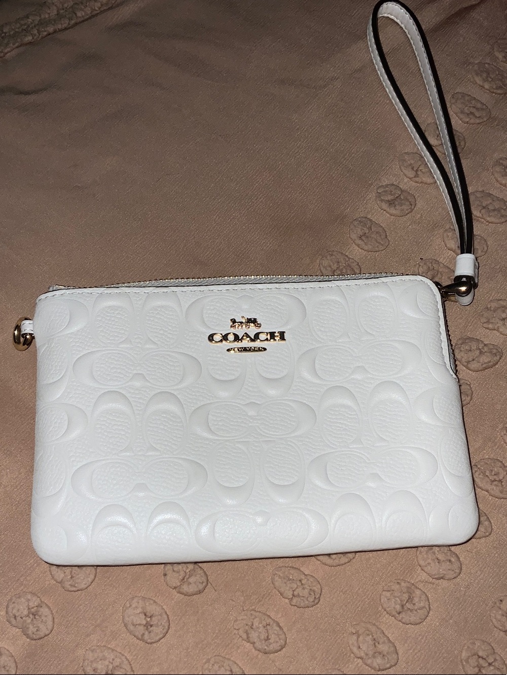 COACH White Embossed Signature Wristlet with Gold Hardware